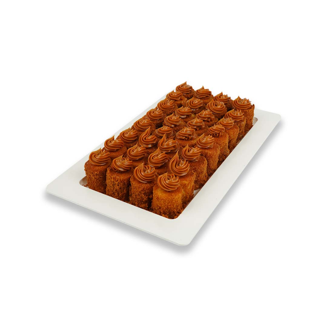 savoury snack platter featuring bite-sized crispy rolls topped with creamy swirls,