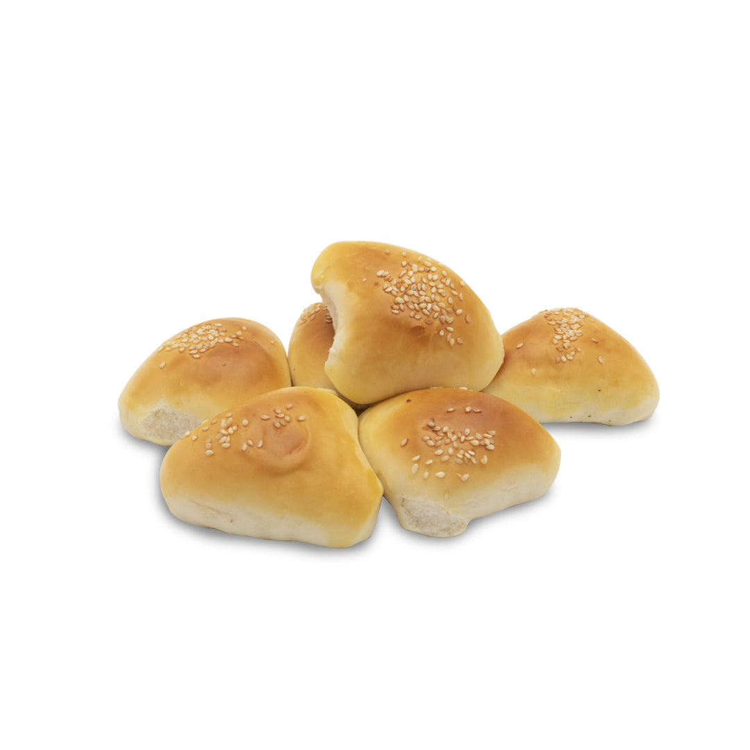 A group of ten frozen feta cheese fatayers on a white background, with a visible sesame seed sprinkle on top.